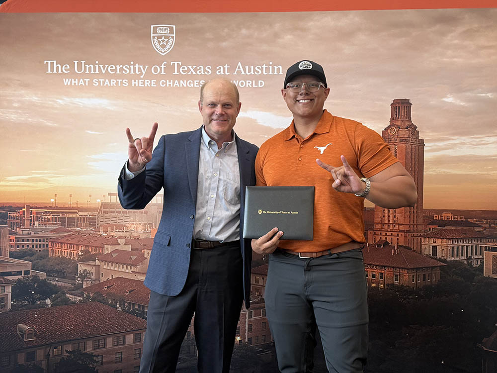 Dario Garcia (right) at TxEEE graduation reception with UT Mechanical Engineering Professor Eric Bickel.